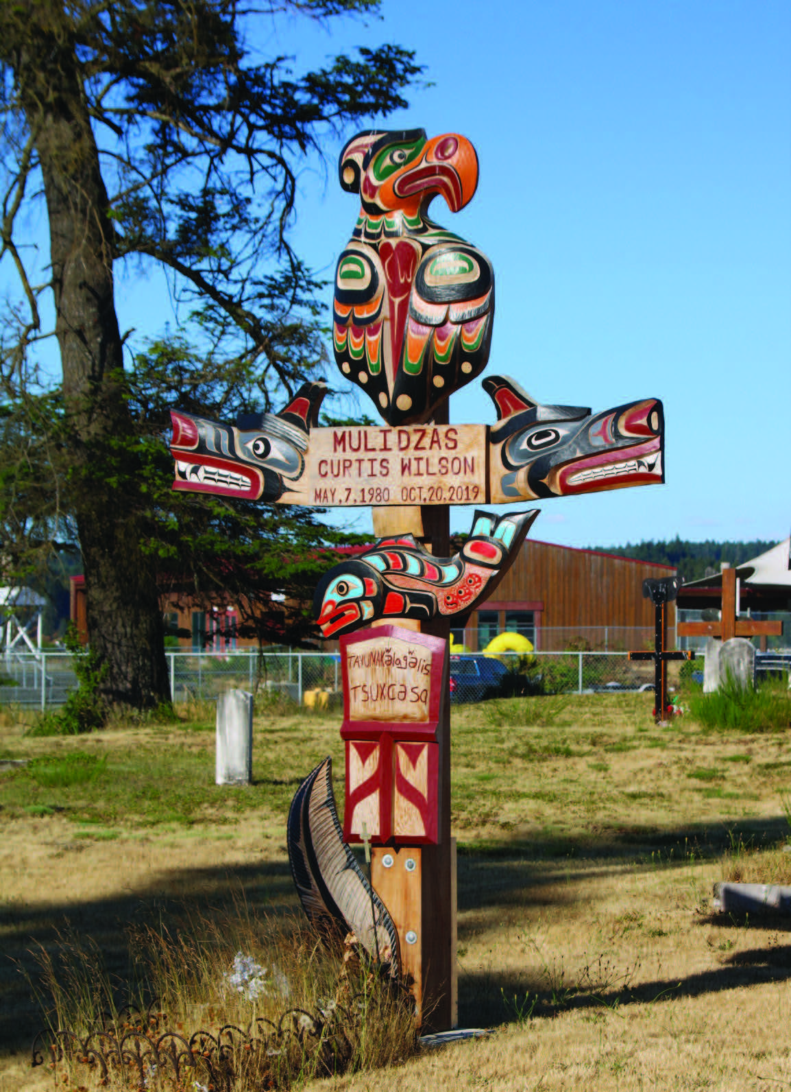 A pole dedicated to the late Curtis Wilson, who designed the Indigenous version of the Canadian flag. Photo by Marianne Scott.