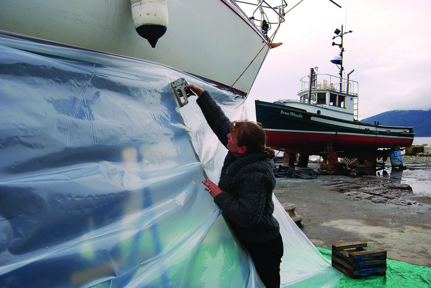 Staple the plastic to the wood stringers.